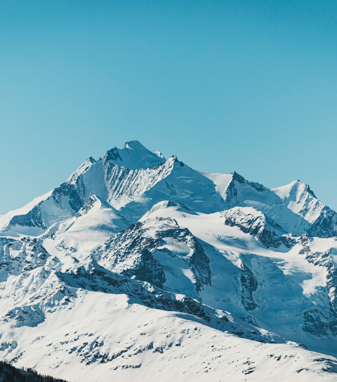 snow covered mountain under blue sky during daytime